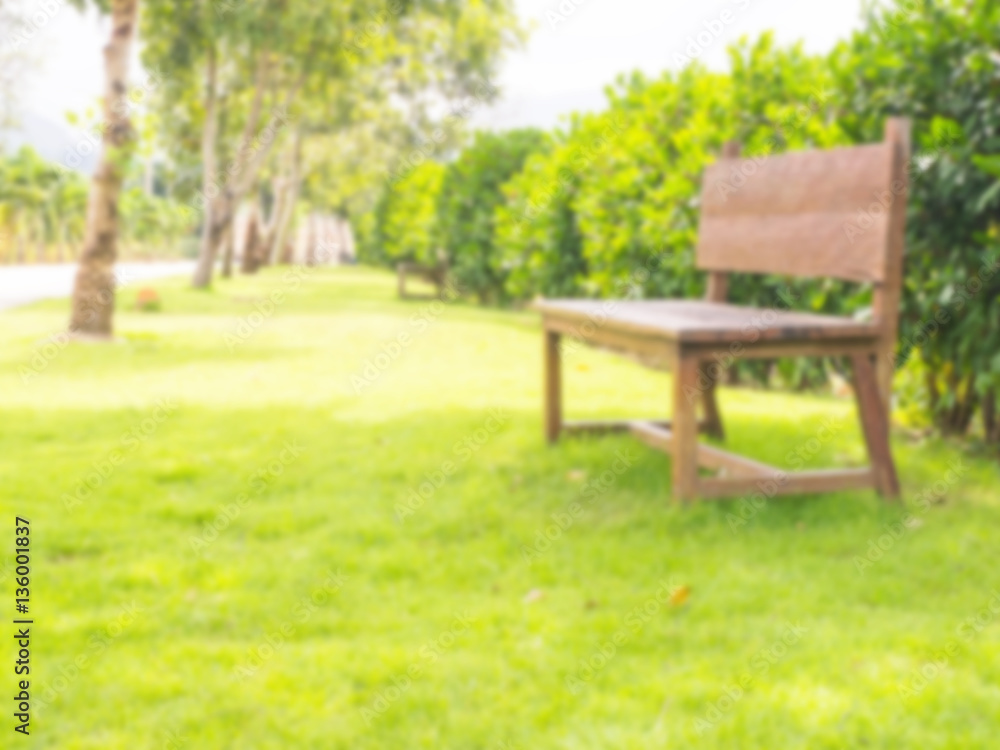 Soft blur wooden bench in the park