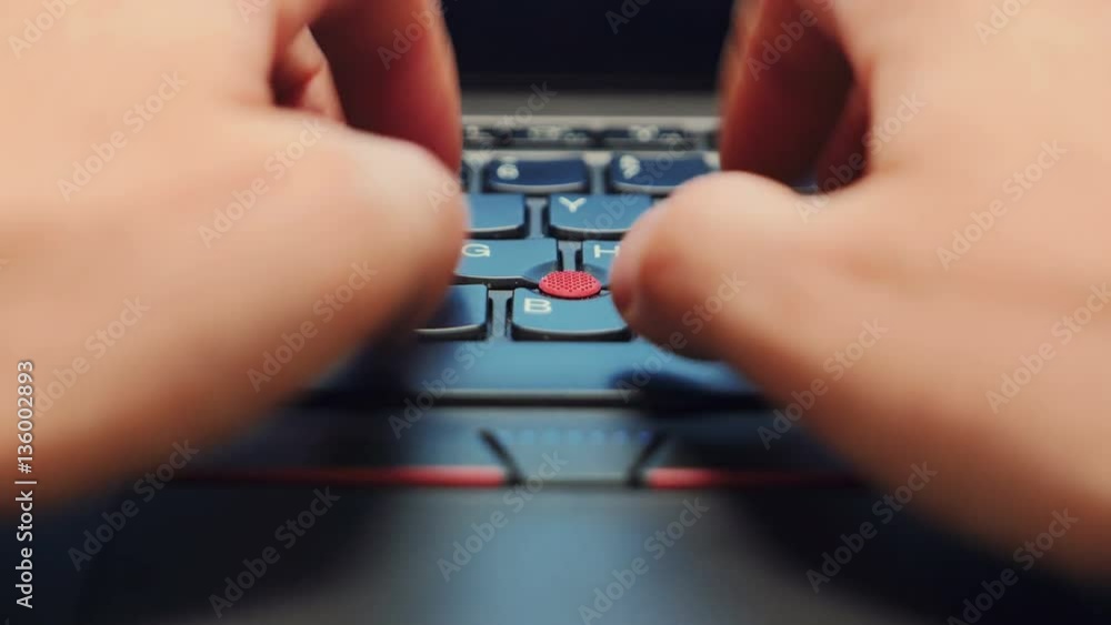 A macro shot of an office worker typing on a laptop keyboard
A macro shot of an office worker typing on a laptop keyboard