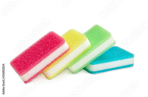 Synthetic cleaning sponges different colors on a light backgroun