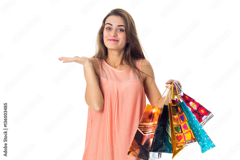 young beautiful girl in a bright dress holding different shopping bags young beautiful girl in a bright dress holding different shopping bags