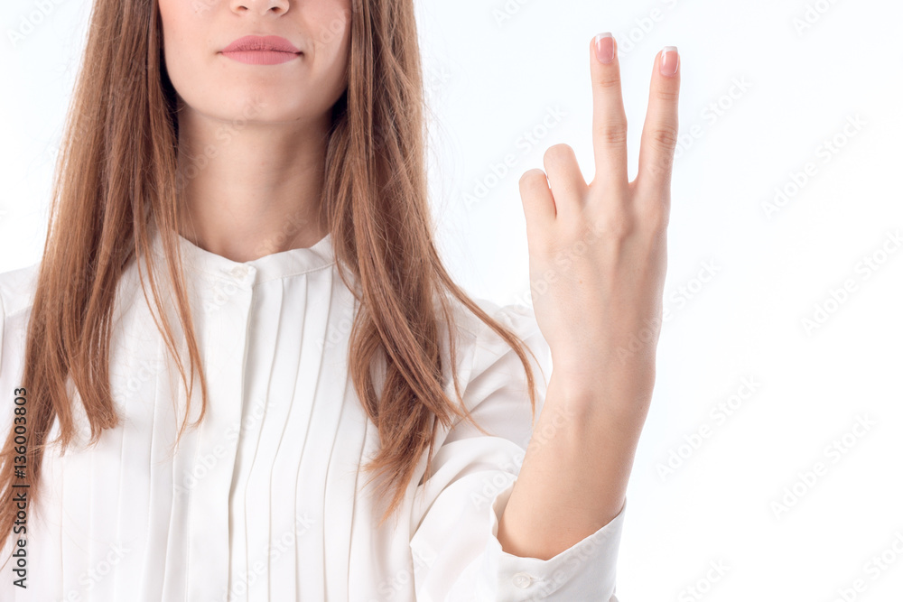 the girl in the white blouse lifted up two finger the girl in the white blouse lifted up two finger