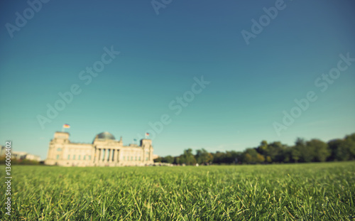 Photography green lawn with the blurred Reichstag building in background, the national germa