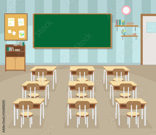 Empty school classroom with green chalkboard