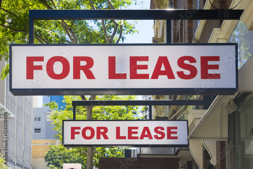 For Lease signs on display outside buildings photo