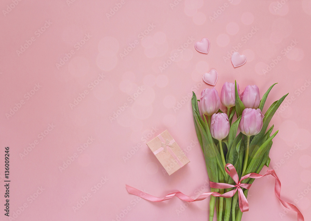 Romantic background with bouquet of tulips and gift box on pink. Romantic background with bouquet of tulips and gift box on pink.