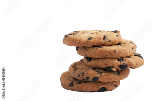 delicious cookies with chocolate stacked in a pile with the top five cookies on white background