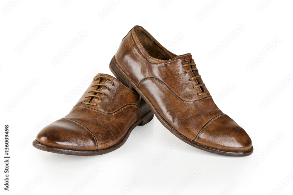 Pair of brown leather men shoes isolated on white. Men Brown Shoes. Stylish brown leather shoes. Men's classic brown leather shoes isolated on white background. Pair of brown leather men shoes isolated on white. Men Brown Shoes. Stylish brown leather shoes. Men's classic brown leather shoes isolated on white background.