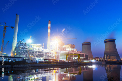 power plant near river at twilight