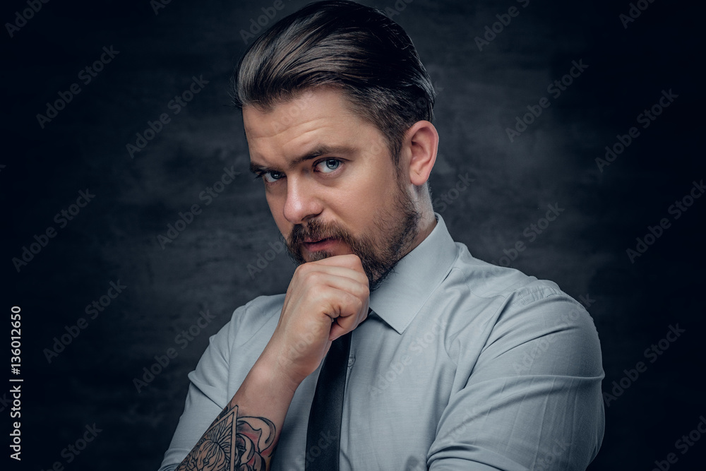 A man with tattoo on his arm. A man with tattoo on his arm.