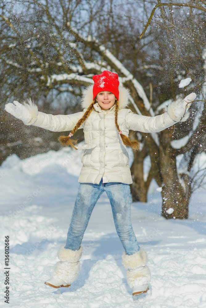 joyful child playing in snow. happy girl having fun outside winter day joyful child playing in snow. happy girl having fun outside winter day