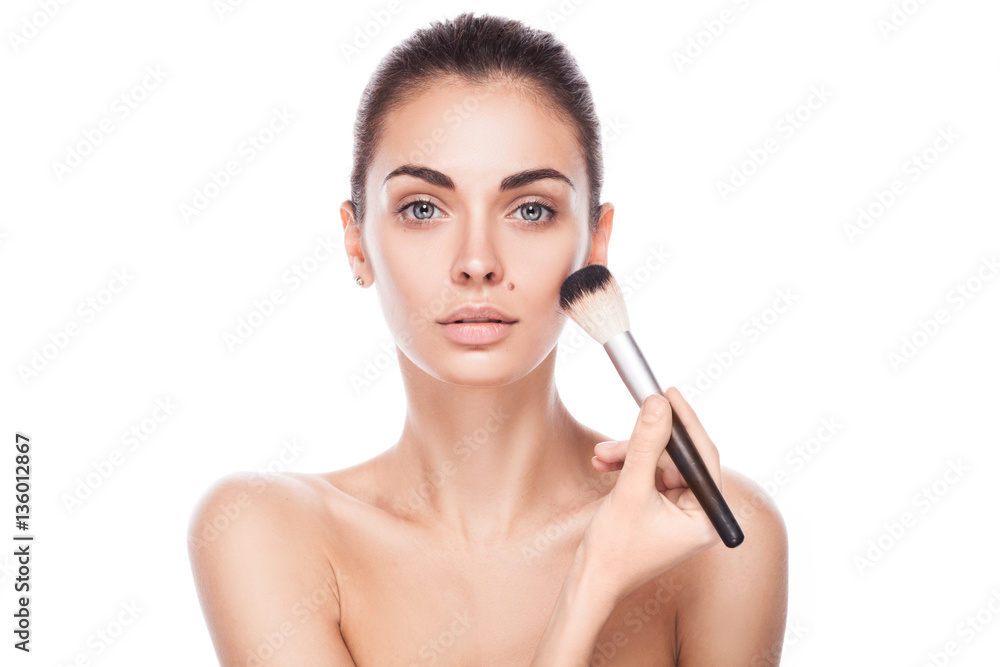 closeup portrait of young adult woman with brush for makeup isolated on white closeup portrait of young adult woman with brush for makeup isolated on white