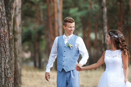Happy wedding couple outdoo...