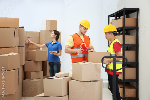 Workers packing parcels at ...
