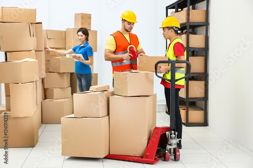 Workers packing parcels at ...