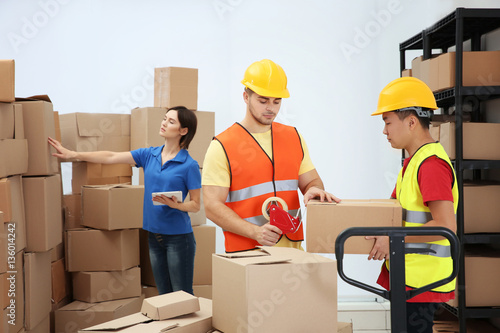Workers packing parcels at ...