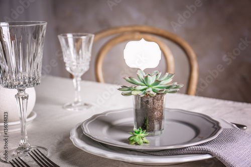 Table served with succulents on plate