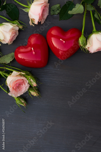 Valentines day hearts with pink roses, copy space on dark wooden background