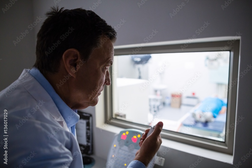 Doctor using x-ray unit control panel Doctor using x-ray unit control panel