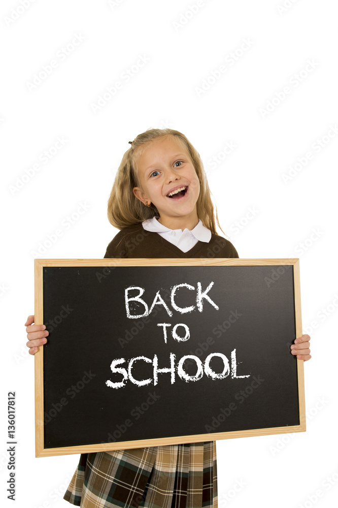 schoolgirl smiling happy holding and showing small blackboard with text back to school schoolgirl smiling happy holding and showing small blackboard with text back to school