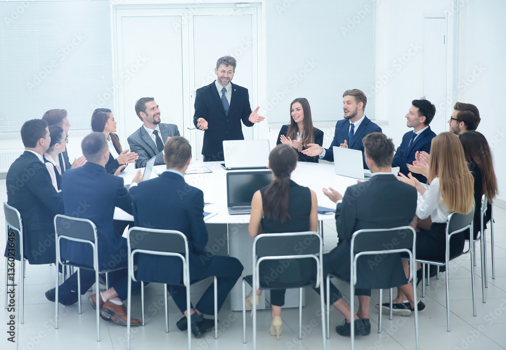 friendly business team applause greeted his boss before the busi friendly business team applause greeted his boss before the busi