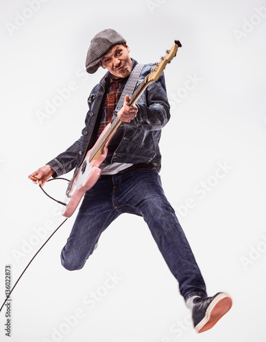 Photography Bassist plays bass guitar.
