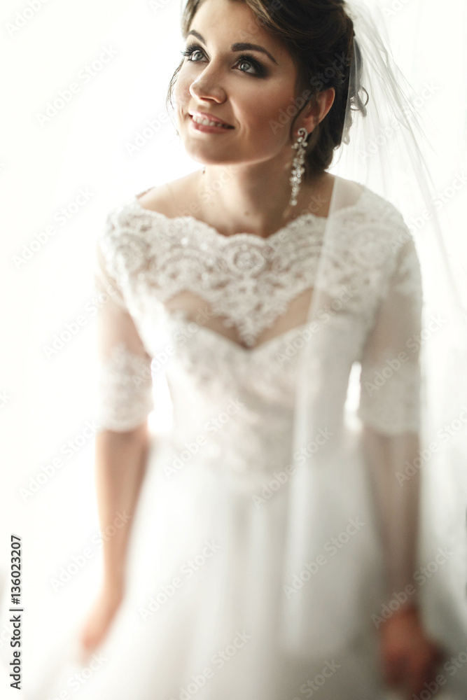 Look from above at stunning brunette bride raising her head up Look from above at stunning brunette bride raising her head up
