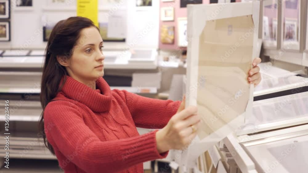 Choosing picture frames in store Choosing picture frames in store