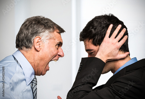 Boss yelling to an employee photo