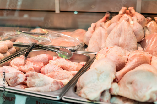 Fresh chicken on display in a meat market counter