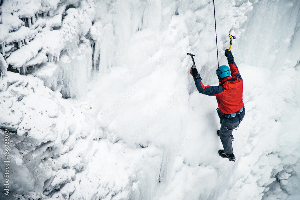 men climbed a frozen waterfall, icicle men climbed a frozen waterfall, icicle