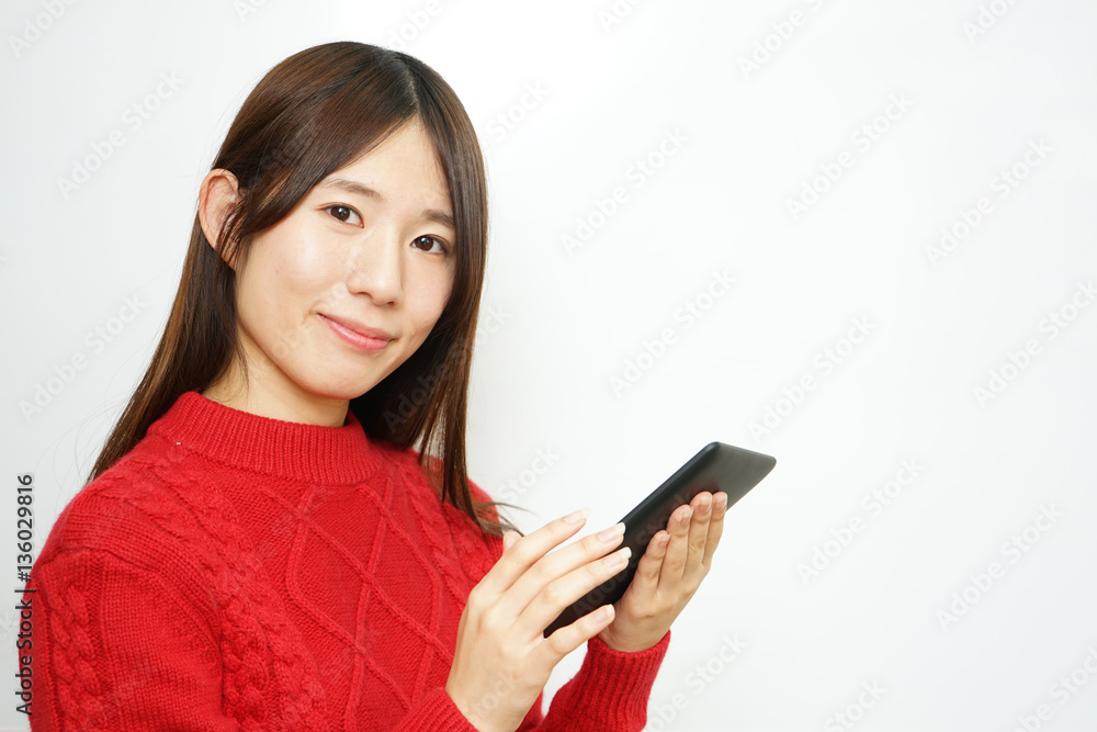 Young woman using a smart phone with smile Young woman using a smart phone with smile