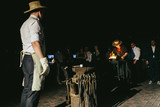 Fire sparkles while blacksmith works
