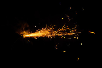 Burning fuse on black background