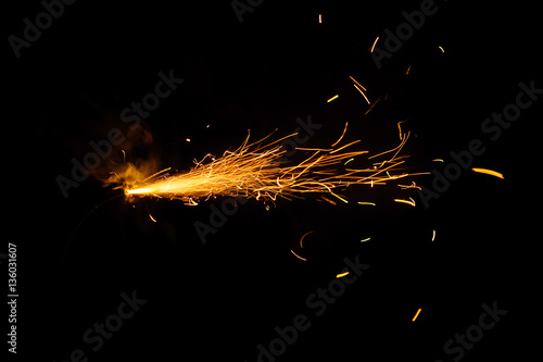 Burning fuse on black background photo