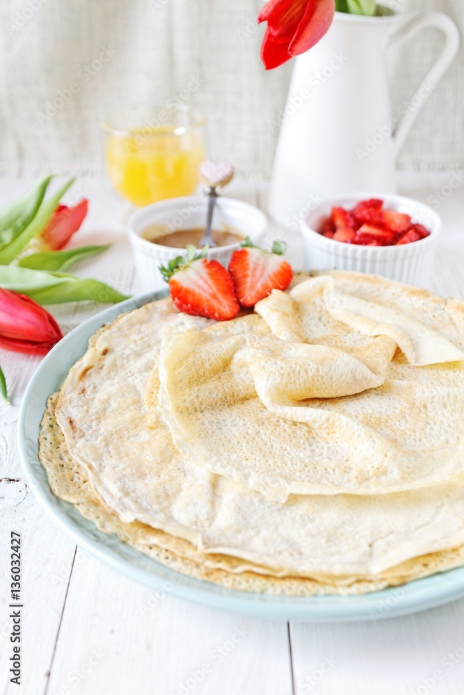 Coconut pancakes with strawberries and caramel