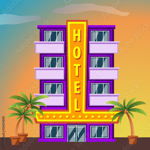 Miami Beach Hotel building with palm trees at sunset
