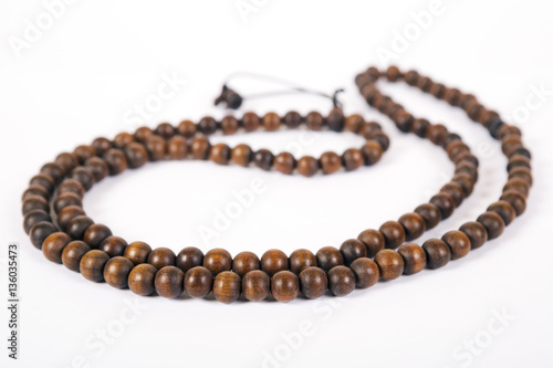 Wooden beads are isolated on a white background