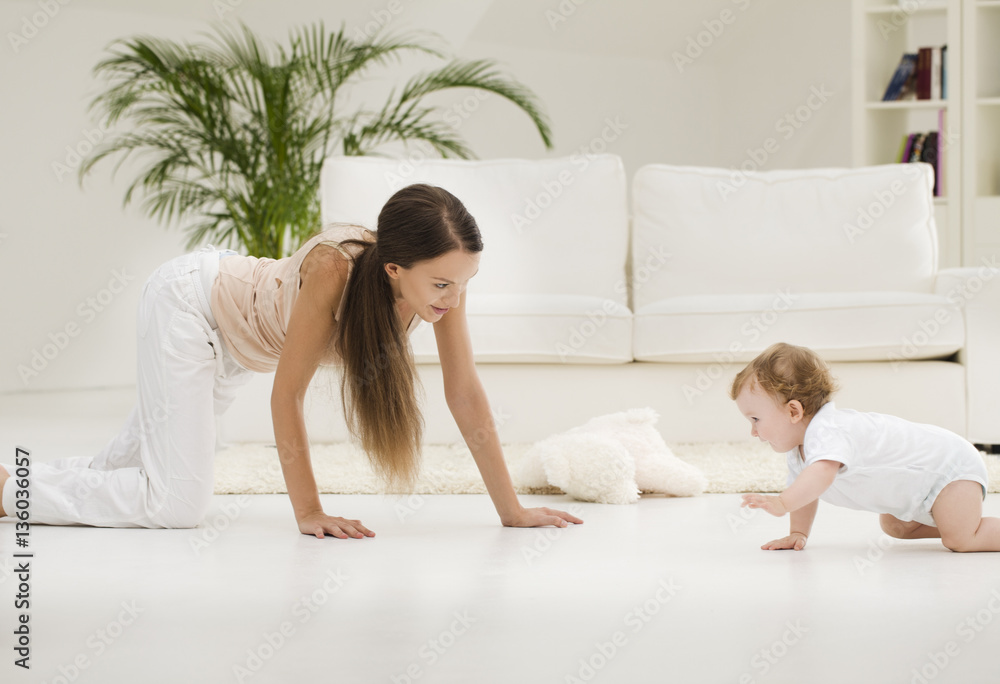 Mother and Baby Playing on the Floor Mother and Baby Playing on the Floor