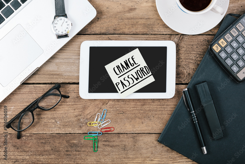 Change Password text on note on office desk Change Password text on note on office desk