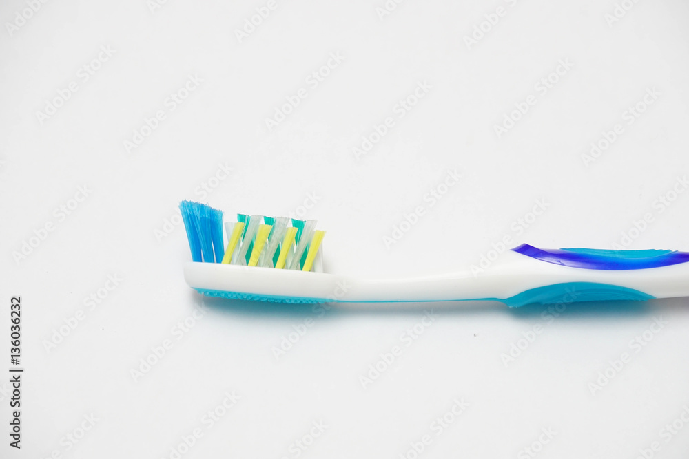Blue tooth brush on isolated white background. Healthy lifestyle concept. Blue tooth brush on isolated white background. Healthy lifestyle concept.