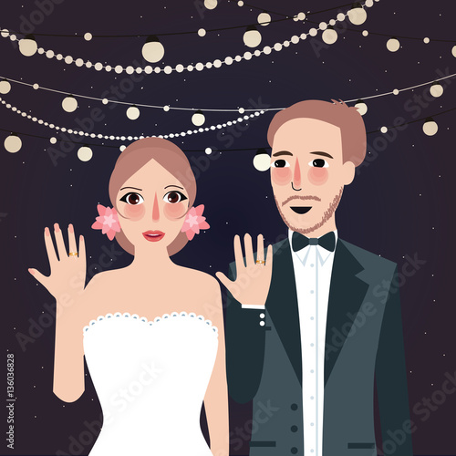 couple at wedding show their ring party at night light string hanging
