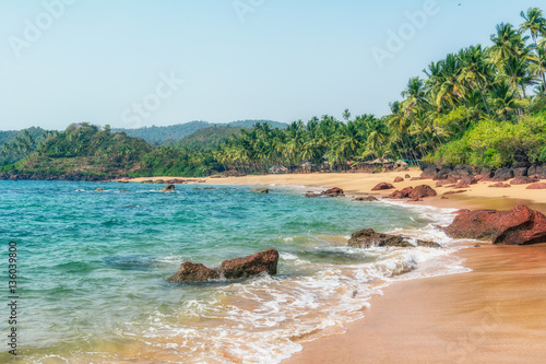 Ocean Beach in summer sunlight. Goa, India. Vivid, splittoned image.  photo