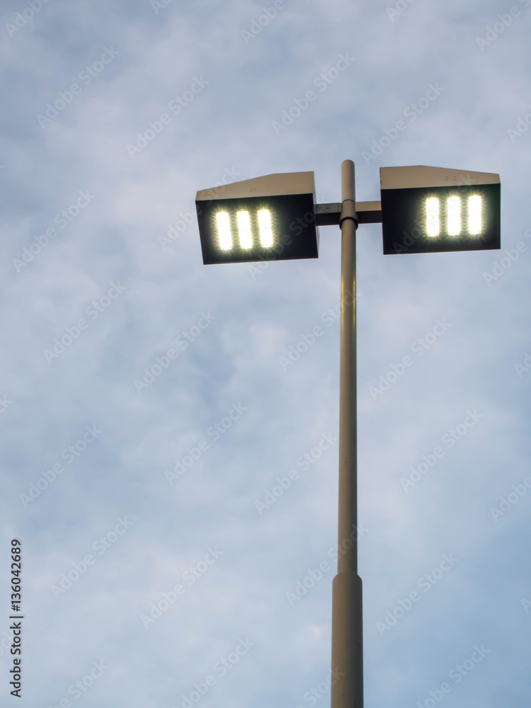 Pillar spotlights on blue sky background Pillar spotlights on blue sky background