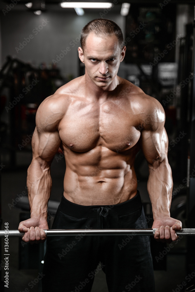 young man train in gym healthcare lifestyle sexy caucasian man. young man train in gym healthcare lifestyle sexy caucasian man.