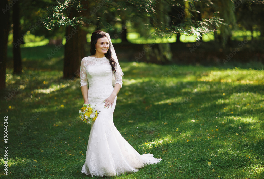 Gorgeous bride in the fresh green park