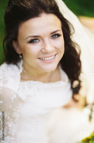Portrait of the brunette bride with the blue eyes