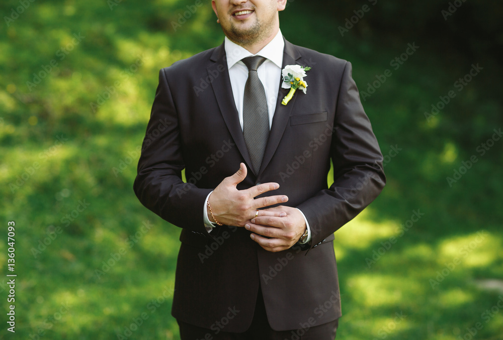 Elegant groom in the black suit Elegant groom in the black suit