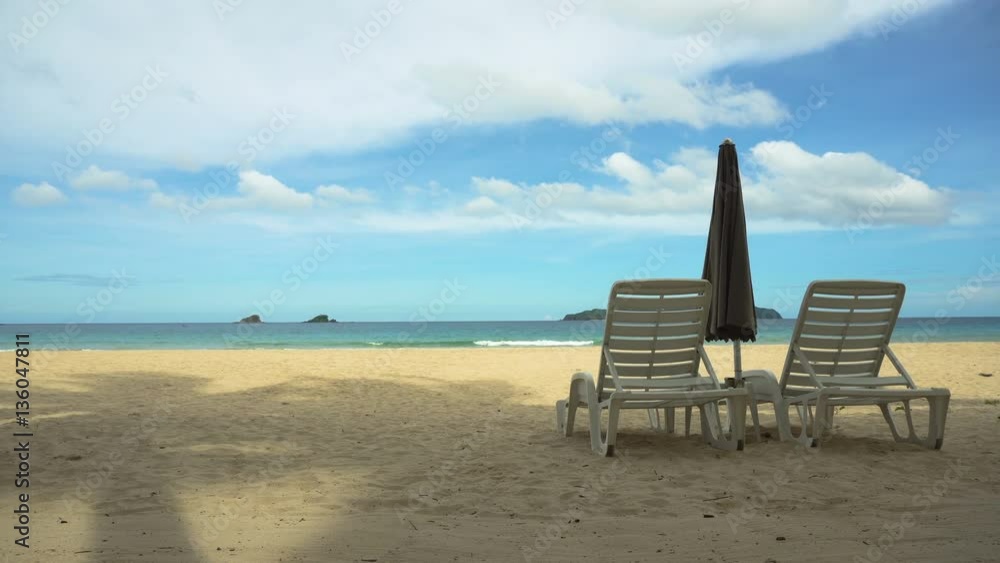 Beach with deck chairs, sun beds, umbrellas.Beach, sea, sand,wave. Seascape ocean and beautiful beach paradise, blue sky, clouds. Philippines El Nido4K videoTravel concept Beach with deck chairs, sun beds, umbrellas.Beach, sea, sand,wave. Seascape ocean and beautiful beach paradise, blue sky, clouds. Philippines El Nido4K videoTravel concept