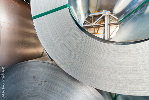 Metail coils stacked in a warehouse photo