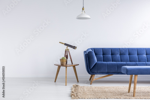 Bright apartment with blue sofa